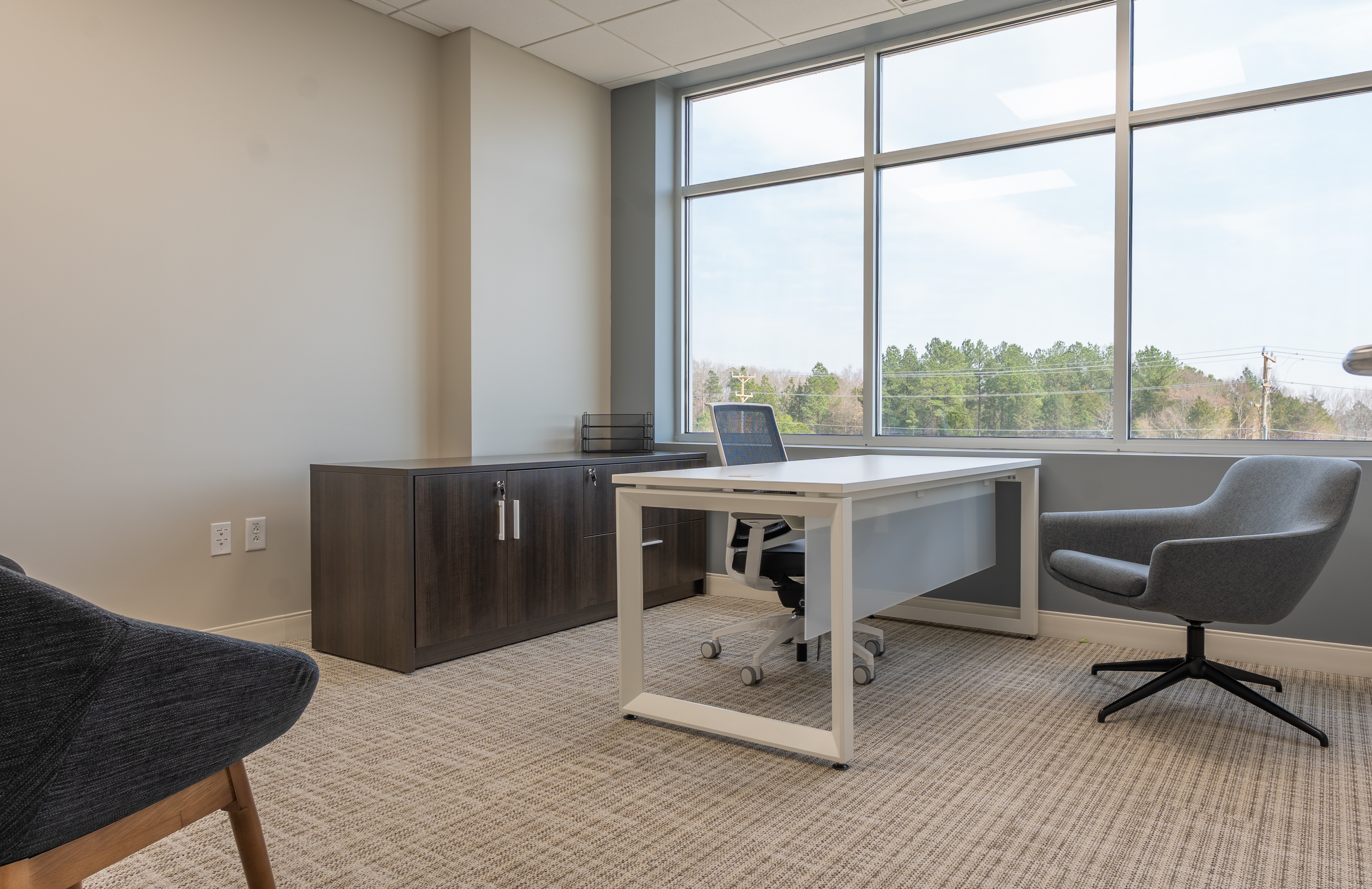 Automotive office installation with completed commercial furniture